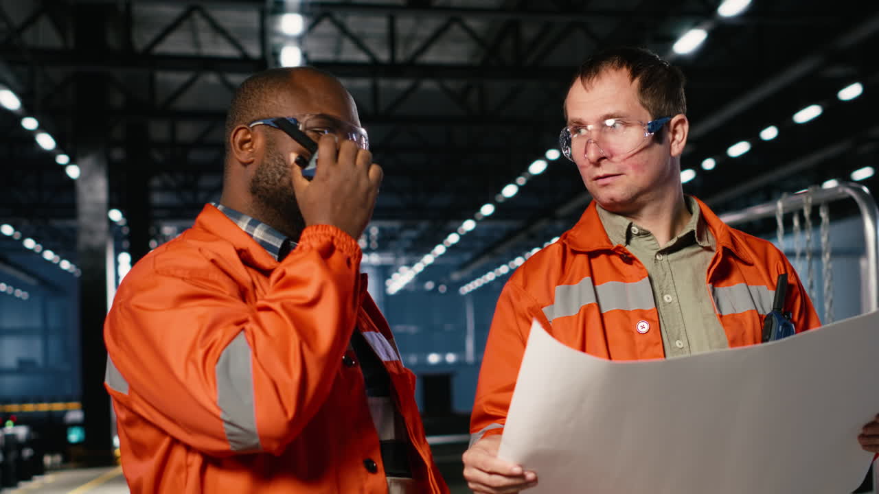 Industrial staff team overseeing fabrication tools in heavy industry plant