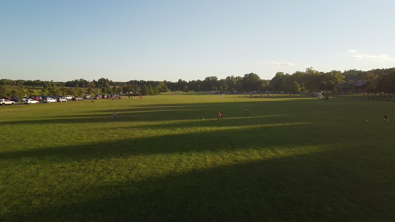 Girls training in soccer, running and kicking a ball at Liberty Park, Clarksville, Tennessee, USA - aerial flyover