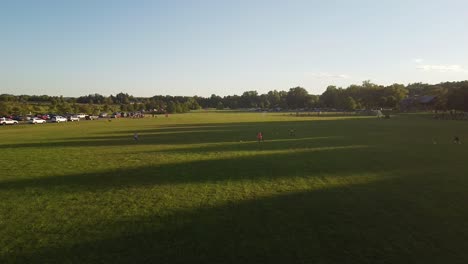 girls training in soccer, running and kicking a ball at liberty park, clarksville, tennessee, usa - aerial flyover