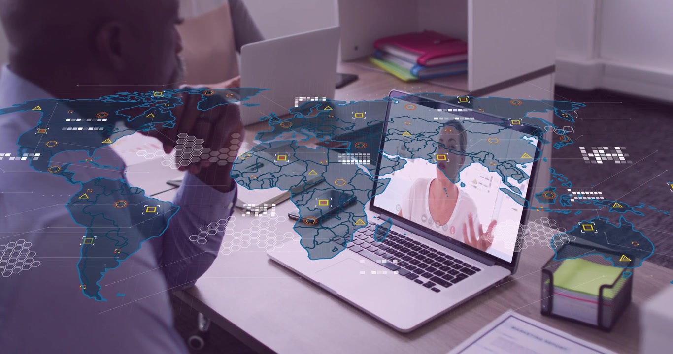 Man Attending Video Call on Laptop with Global Network Overlay