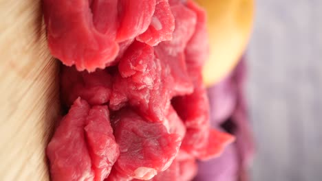 raw beef steak on cutting board