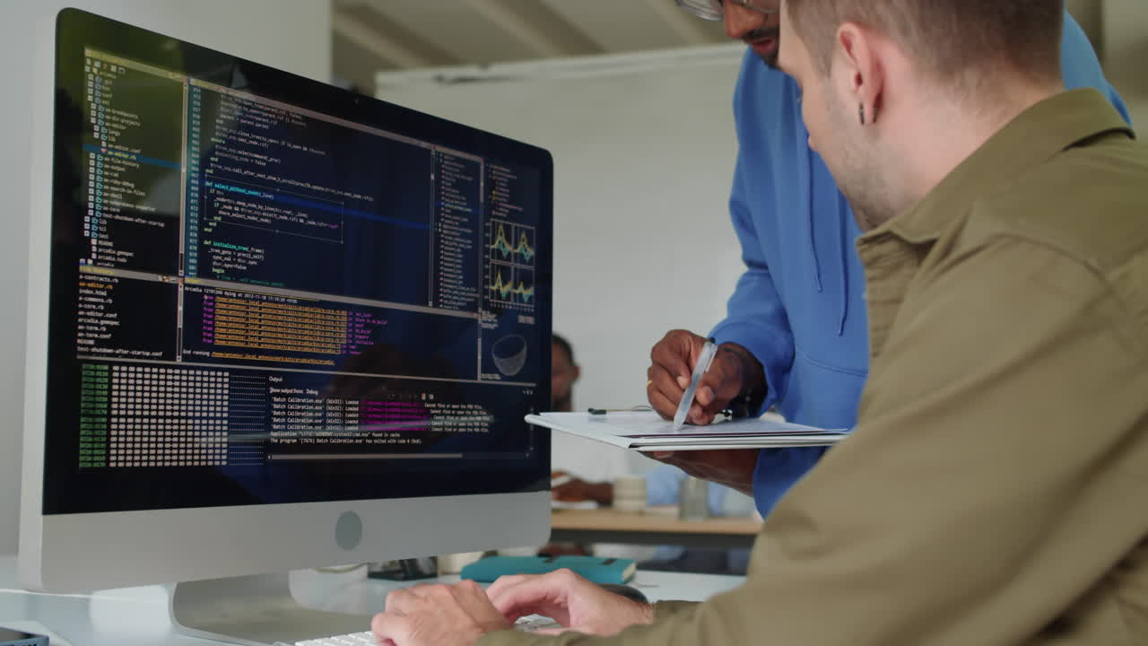 Employees Coding on Computer at Startup Office