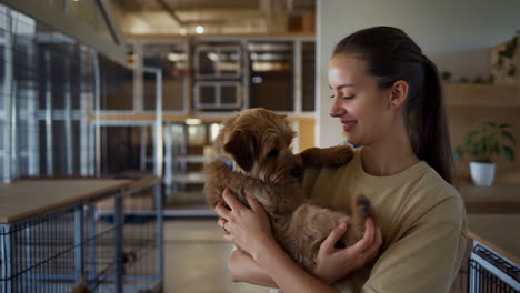 a woman holding a puppy