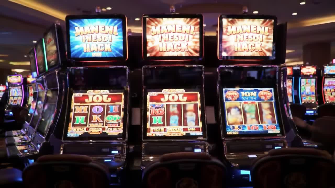 A Night of Luck: Capturing the Thrills of Slot Machines in a Vibrant Casino Setting, Filled with Glowing Lights and Exciting Gaming Atmosphere
