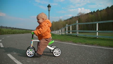 little kid crossing road on bike