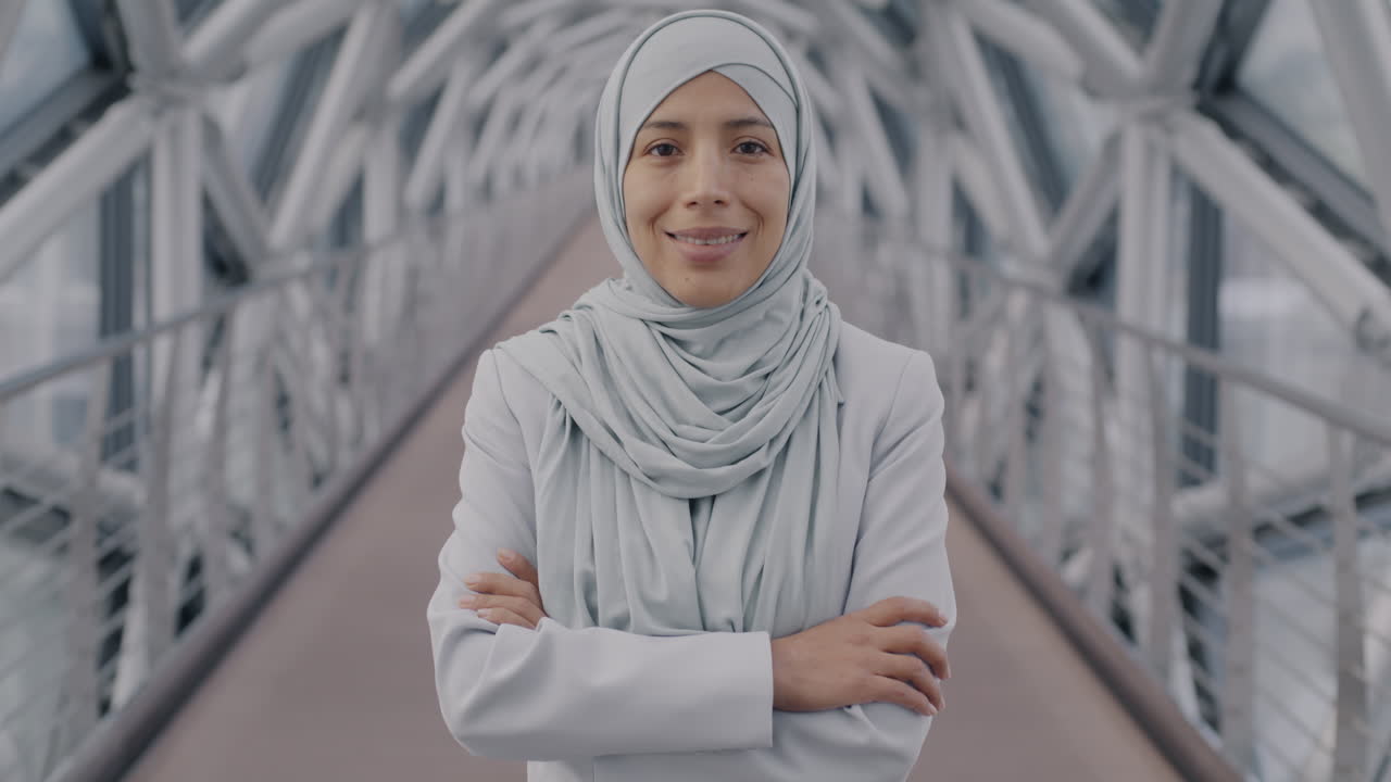 Confident Businesswoman in Hijab on a City Bridge