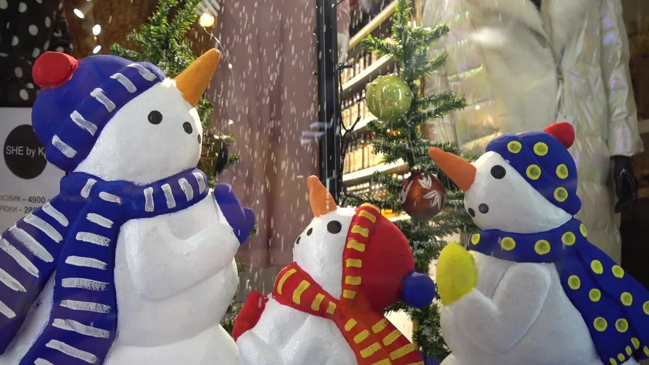 Snowmen in an inverted umbrella
