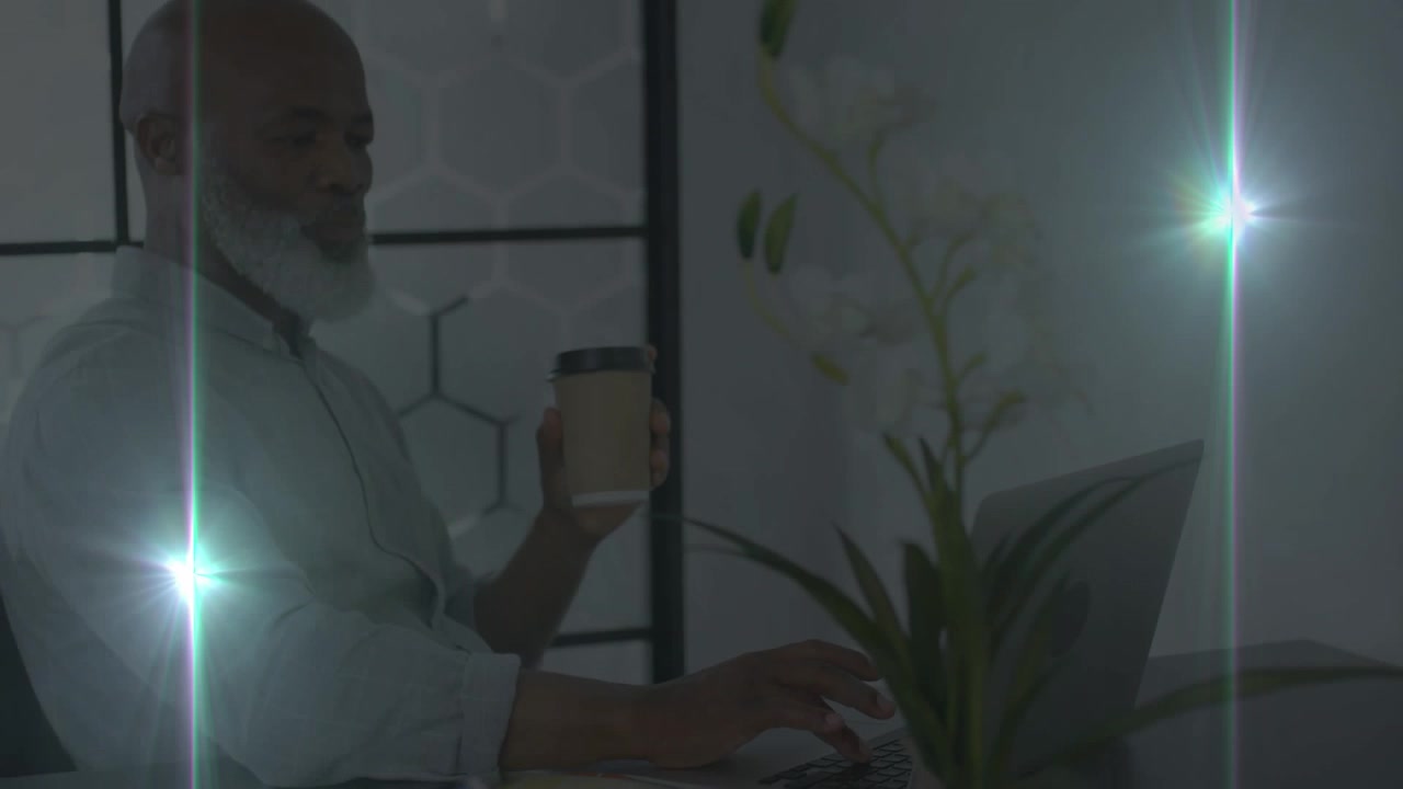 Animation of glowing light moving over businessman working in office