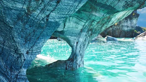 marble caves of chile blue rock formation with animated water