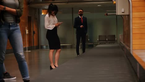 commuters waiting for their luggage at baggage claim area 4k