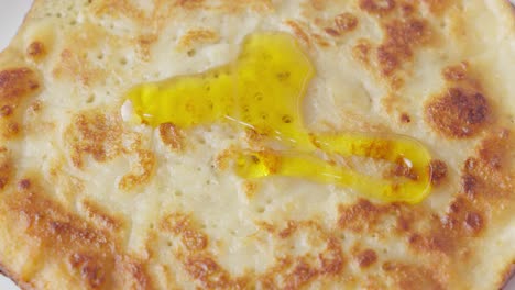 golden maple syrup cascading over pancake like sweet and sticky waterfall