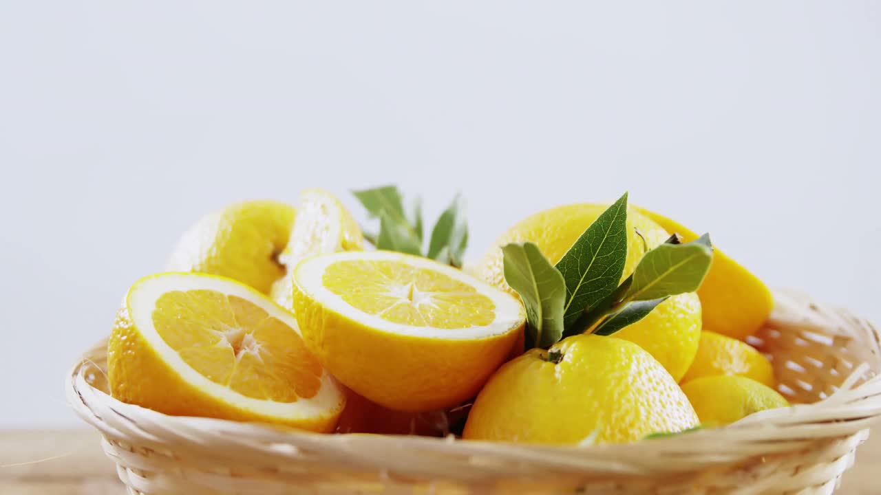 Close-up of sweet limes in wicker basket