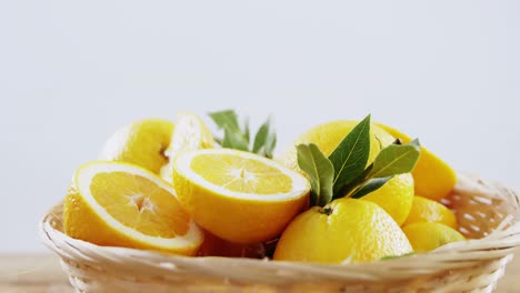 Close-up-of-sweet-limes-in-wicker-basket