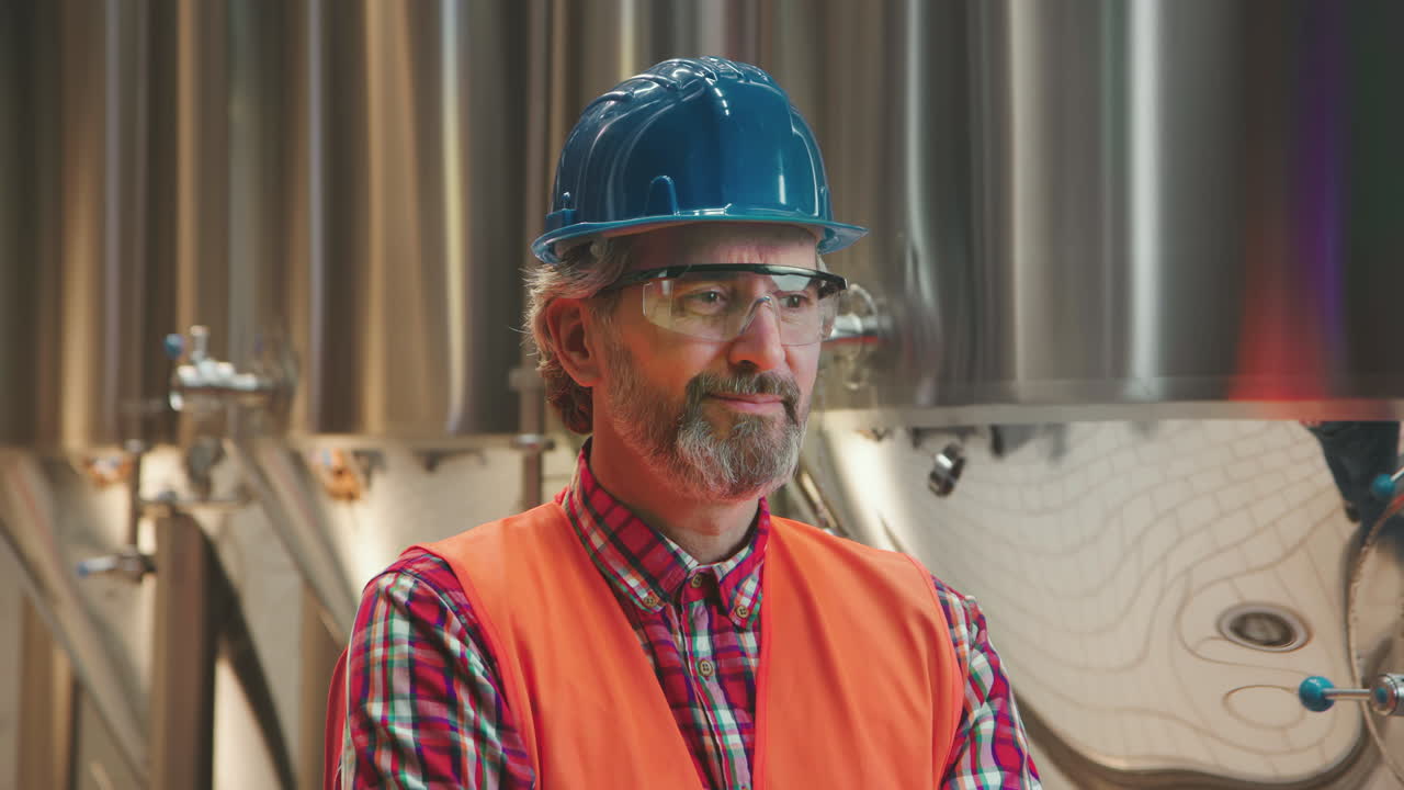 Man in safety gear in an industrial setting