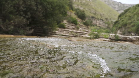 river stream flows in slow motion in nature reserve cavagrande, sicily