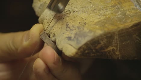 italian goldsmith at work building an engagement or a wedding ring