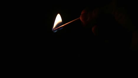 matchstick burning in the dark