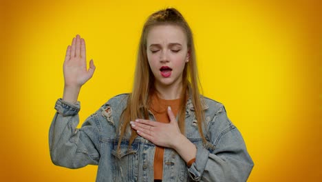 sincere responsible teen girl raising hand to take oath, promising to be honest and to tell truth