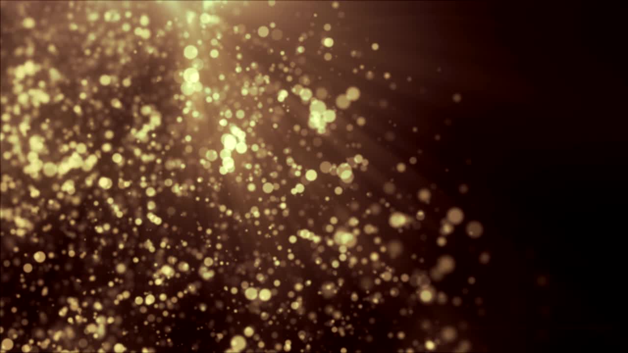hermosas partículas de polvo flotantes de oro con destello en fondo negro