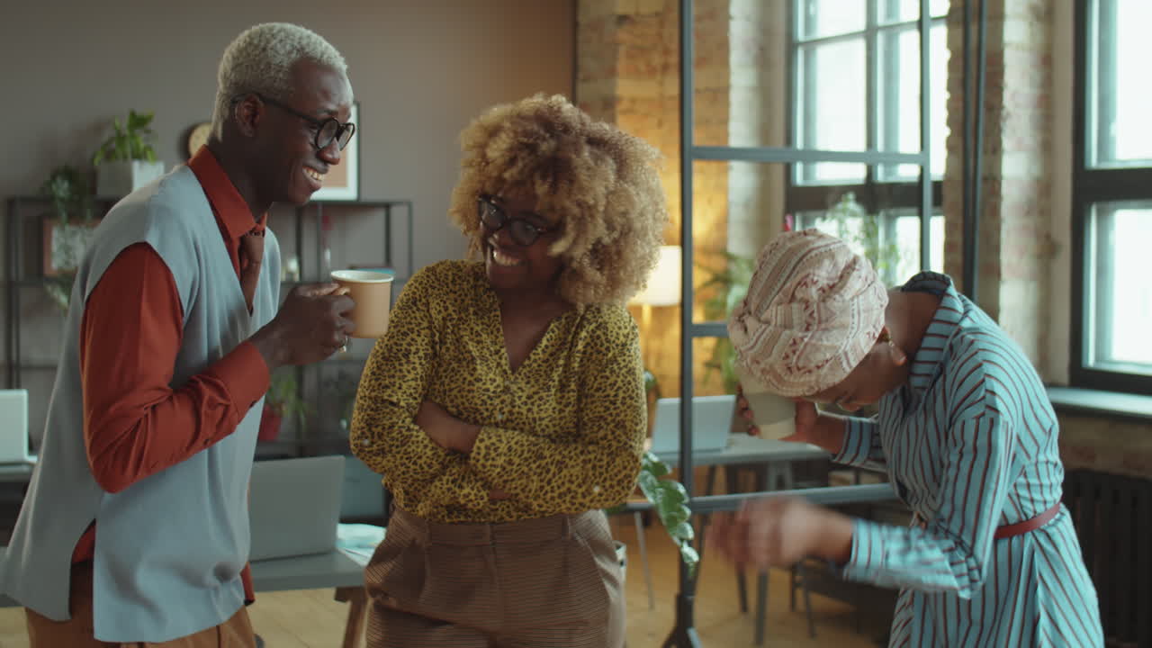 African American Colleagues Chatting on Coffee Break in Office