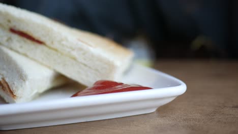 close up of a plate of toast with ketchup