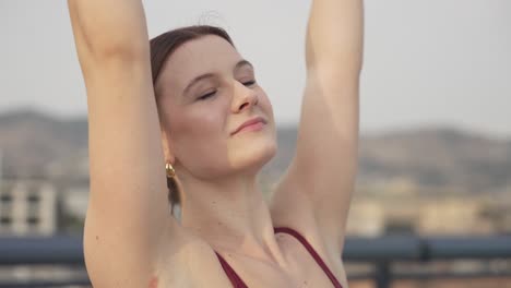 Raising-arms-during-ballet-dancing-outside-on-her-own