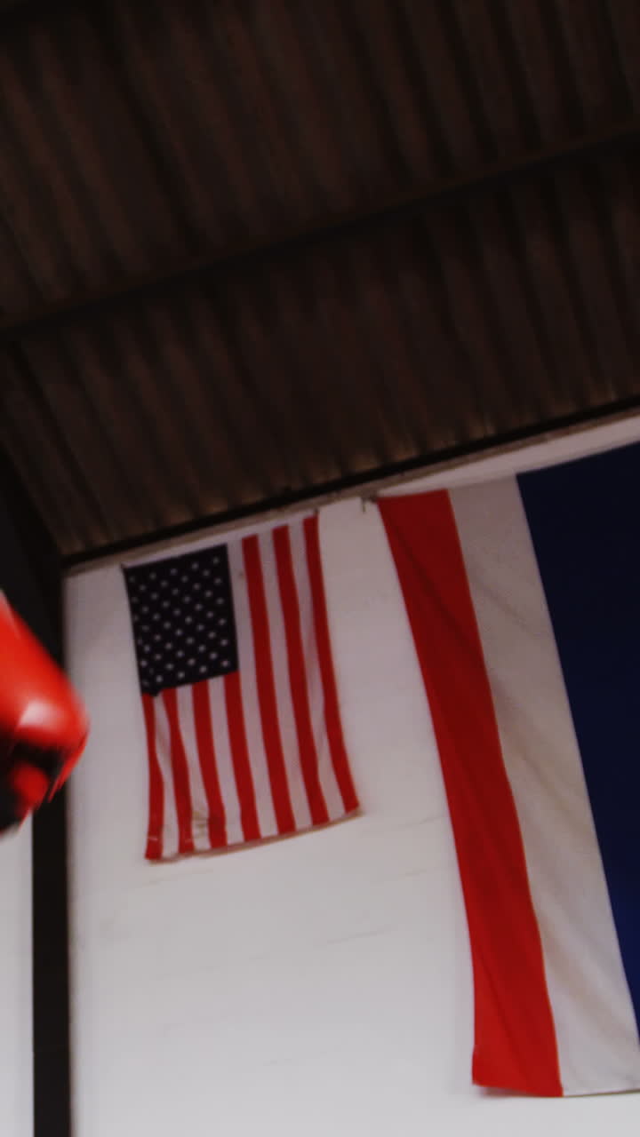 Two boxers practicing in boxing ring