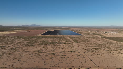 aerial shot of a solar panel field in rural southern arizona near picture rocks, wide aerial shot