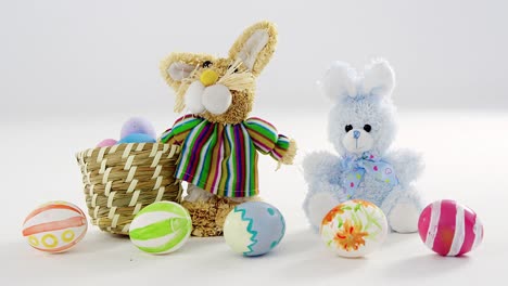 basket with easter eggs and toy easter bunny