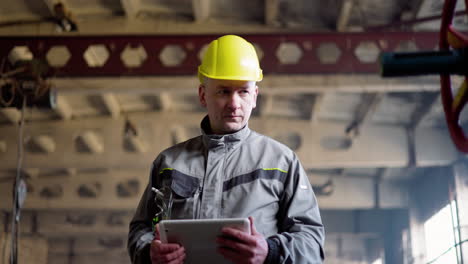 man walking with tablet