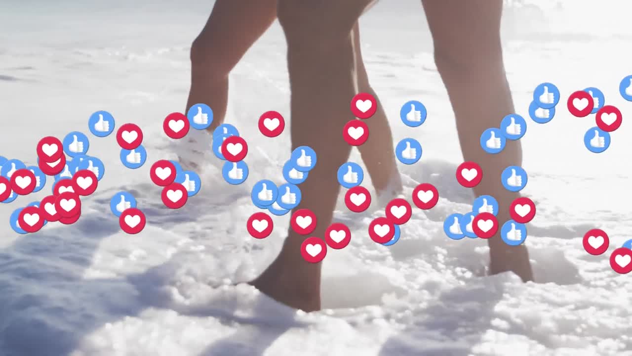 그리고 심장과 같은 아이콘은 해변에서 물에서  ⁇ 는 부부의 낮은 부분에 대해 떠다니고 있습니다.