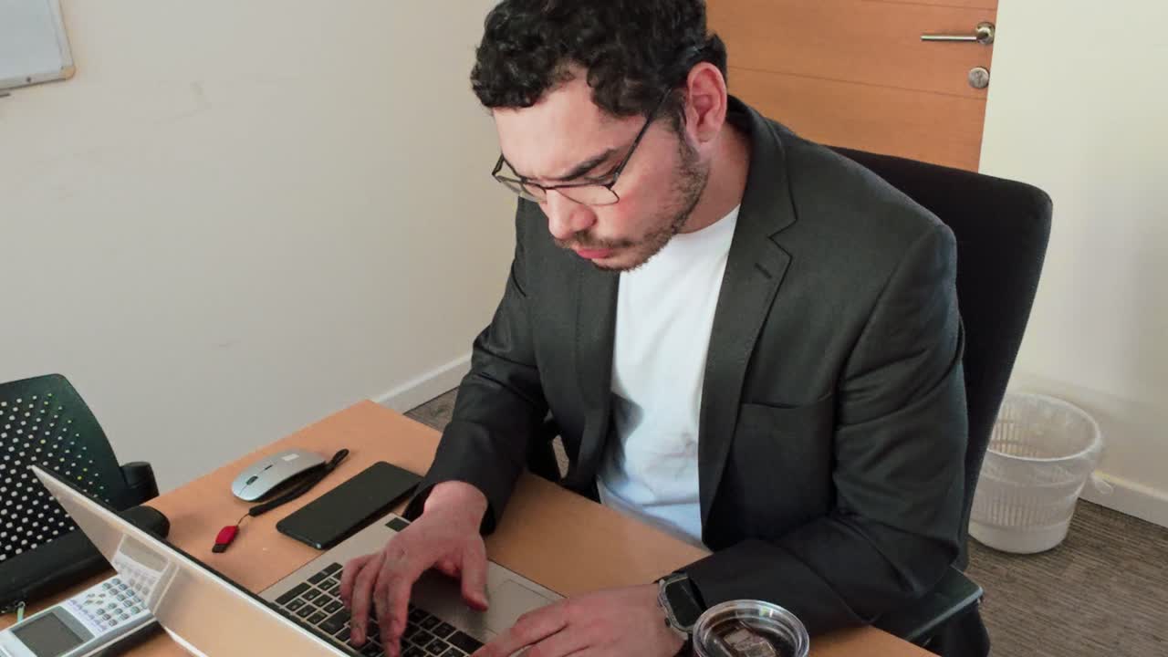 Modern Professional Contemplating at Laptop