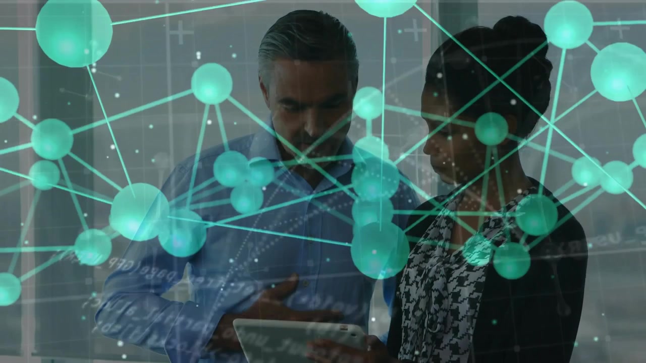 Man tapping tablet and swiping, guiding woman in business office, green node network drifting front