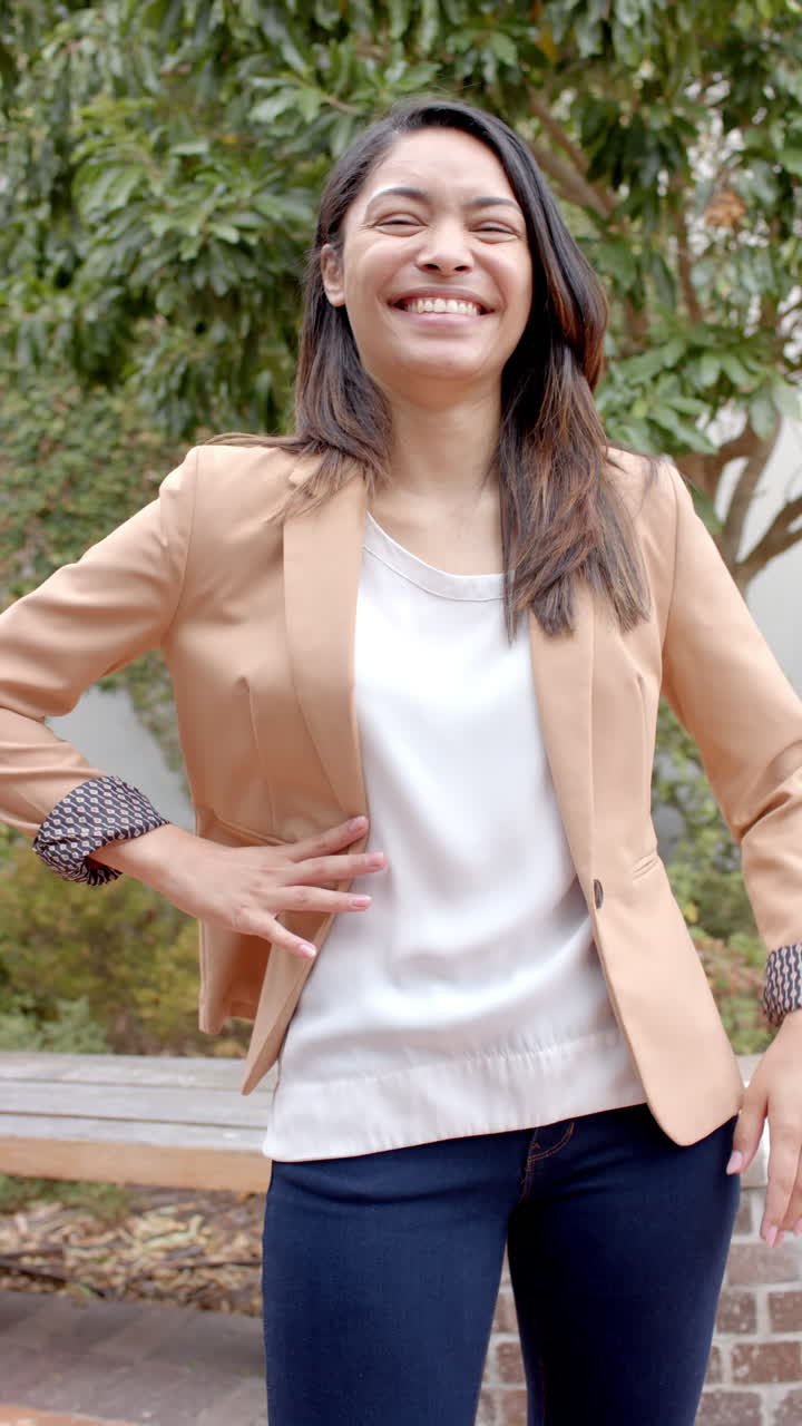 Vertical video: In highschool, biracial female teacher is laughing