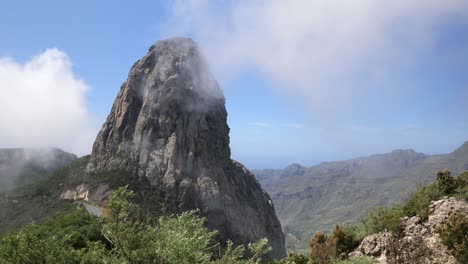 roque de agando or roque agando with clearing clouds to reveal it against a blue sky