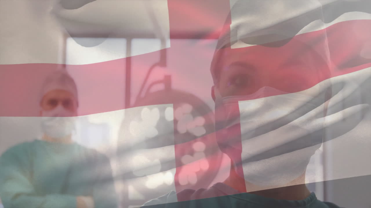 Animation of flag of england over diverse surgeons in hospital