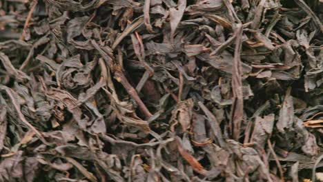 looped spinning dry black tea full frame close-up background