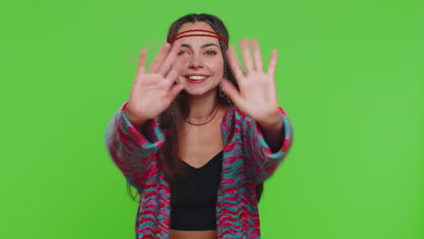 smiling woman in boho outfit on green screen