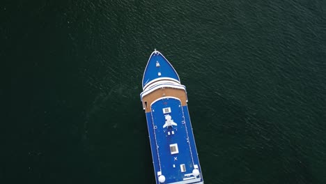 flying over a resting cruise ship on the calm water of the atlantic ocean