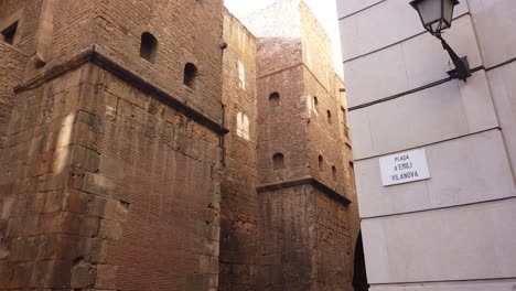 Brown-Golden-Bricks-Gothic-Tower-Architecture-Barcelona-Spain-Birds-Fly-By-Fortress