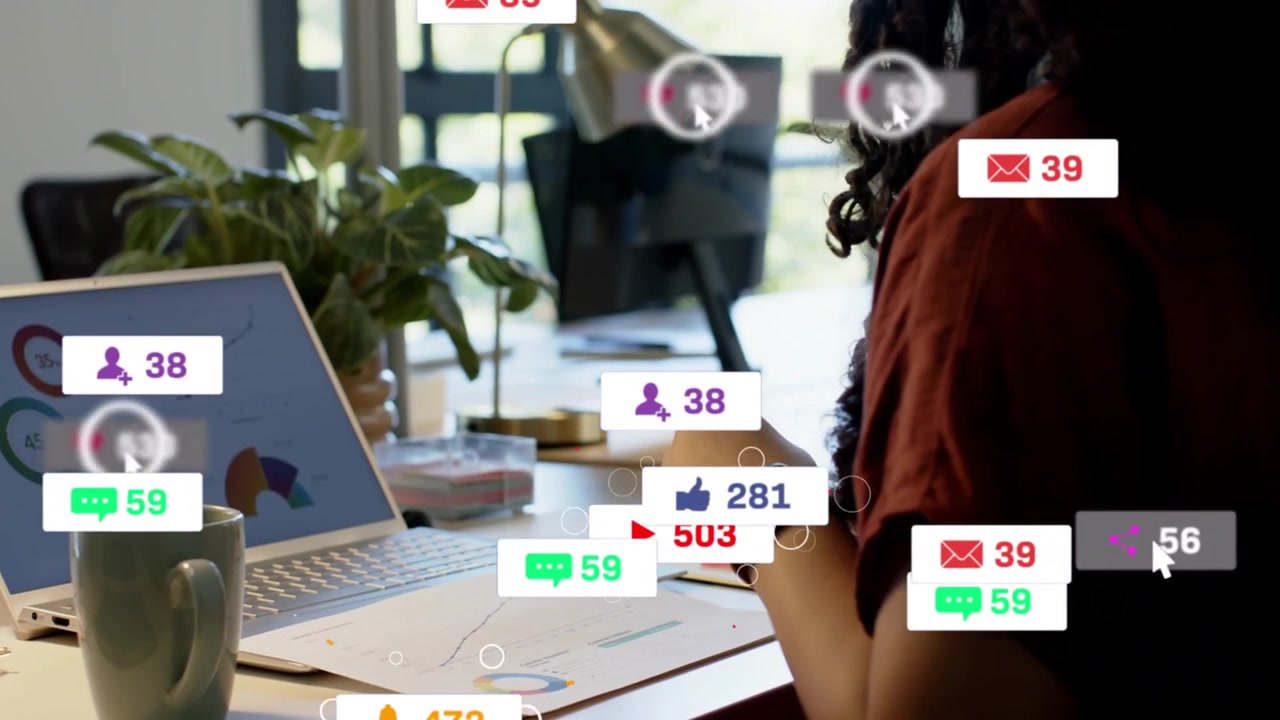 Woman reading charts at laptop, social media icons rising, making her pick phone, tapping to reply