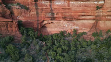 Aerial-view-pull-away-of-Palatki-ruins-in-secret-mountain-wilderness-in-Sedona