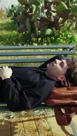 man relaxing in the nature near the sea on a bench