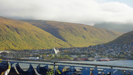 Panorama-Of-City-Of-Tromso-With-Mountains-In-Autumn-Foliage-Backdrop