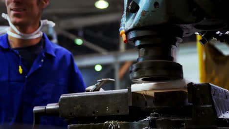 male engineer working on a machine 4k