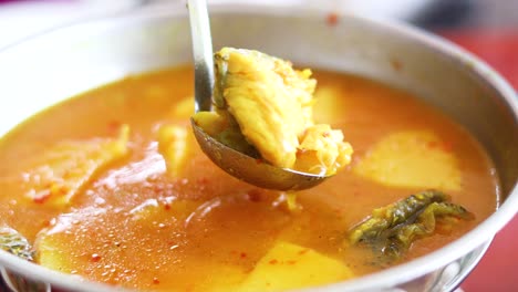 delicious seafood soup being served in thailand