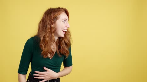 happy red-haired woman expressing joy on yellow background