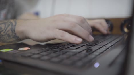 Close-up-hand-typing-on-a-laptop-keyboard