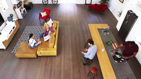 Overhead-Shot-Of-Friends-Cooking-Meal-And-Relaxing-Together