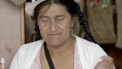 woman threading wool to knit afterwards